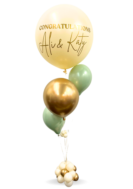 Table centerpiece with custom jumbo balloon