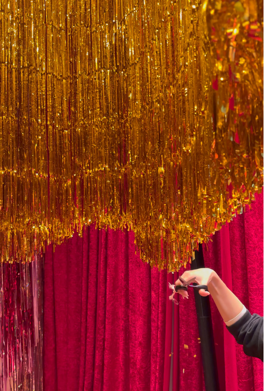 Gold Fringe Chandelier Installation with gold Orbz