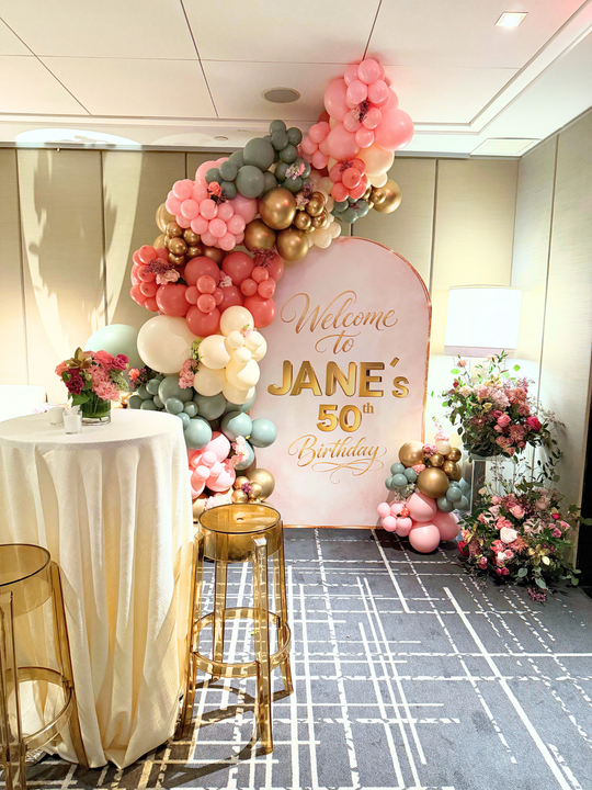 Custom wall backdrop with garland and floral – T.O. Balloons