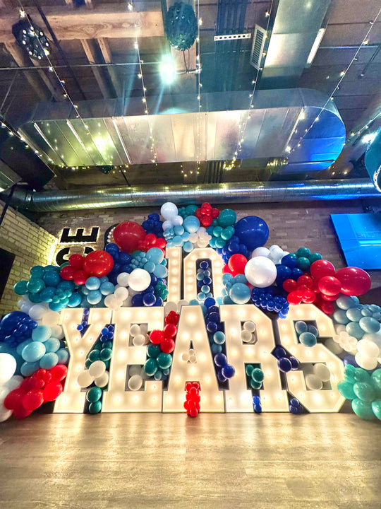 Stacked marquees and balloon garland