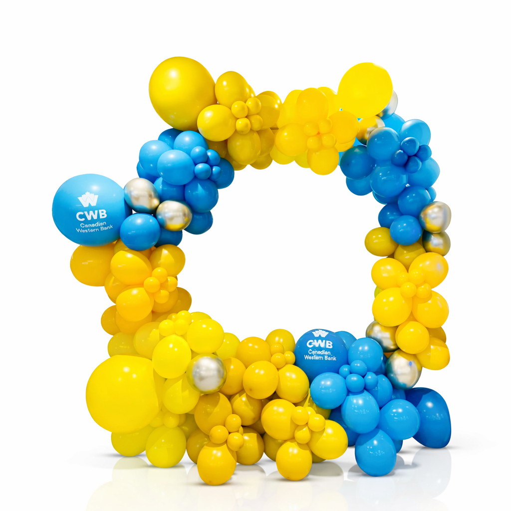 Balloon arch with yellow, blue, and white balloons featuring a CWB logo on a white background