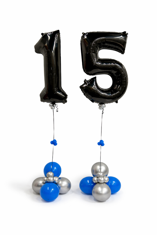 Black number '15' balloons with blue and silver decorations on a white background