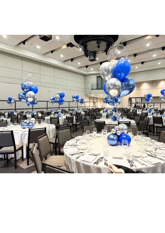 Custom table centrepieces with clear bobos and feathers