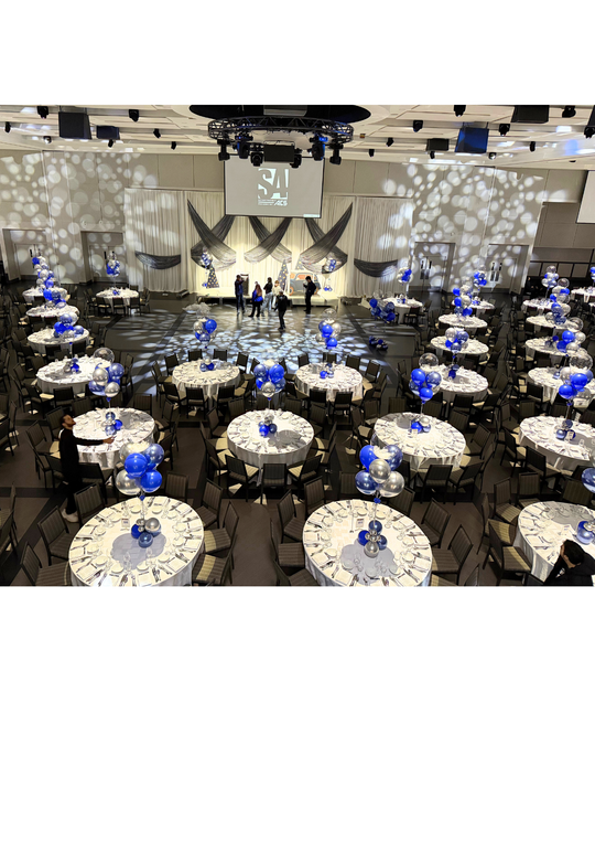 Custom table centrepieces with clear bobos and feathers