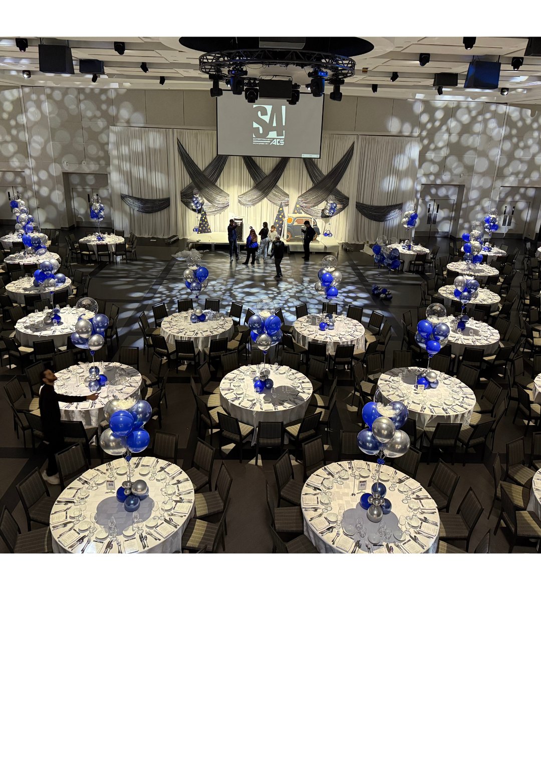 Custom table centrepieces with clear bobos and feathers