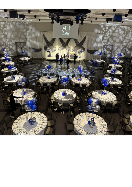 Custom table centrepieces with clear bobos and feathers