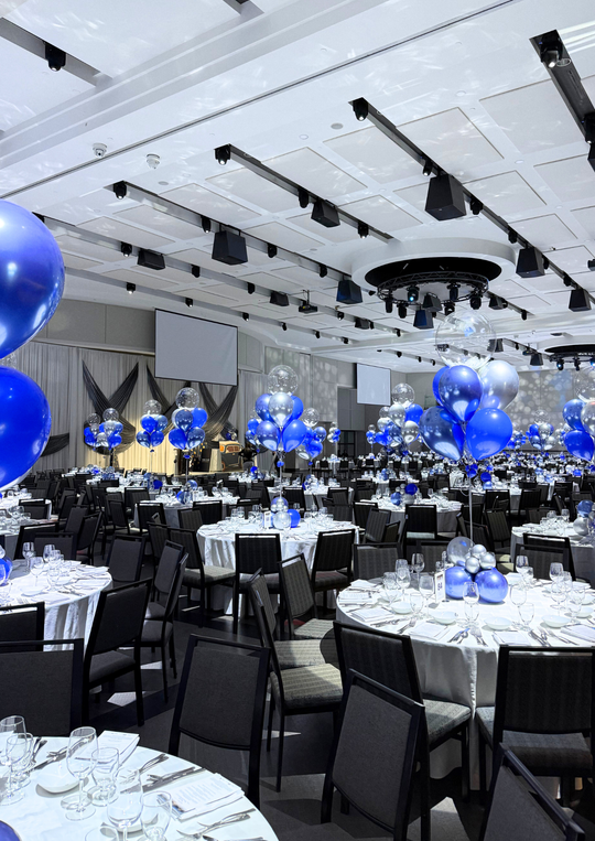 Custom table centrepieces with clear bobos and feathers