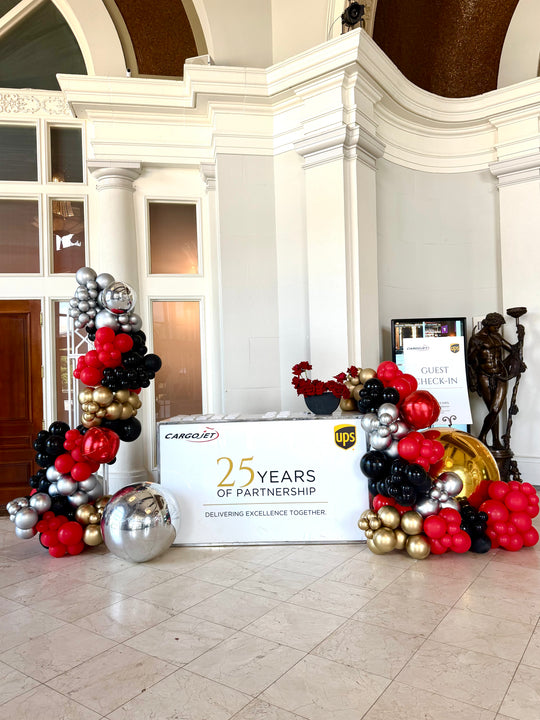 UPS custom balloon install with shimmer wall and welcome desk reception and Marquees