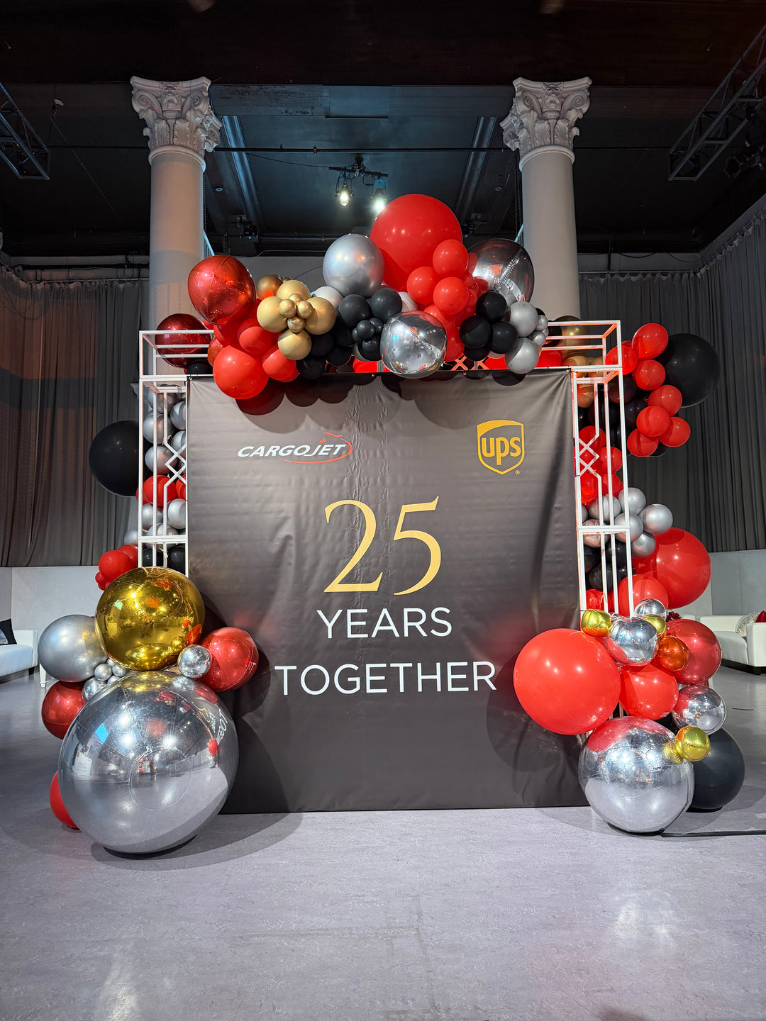 UPS custom balloon install with shimmer wall and welcome desk reception and Marquees