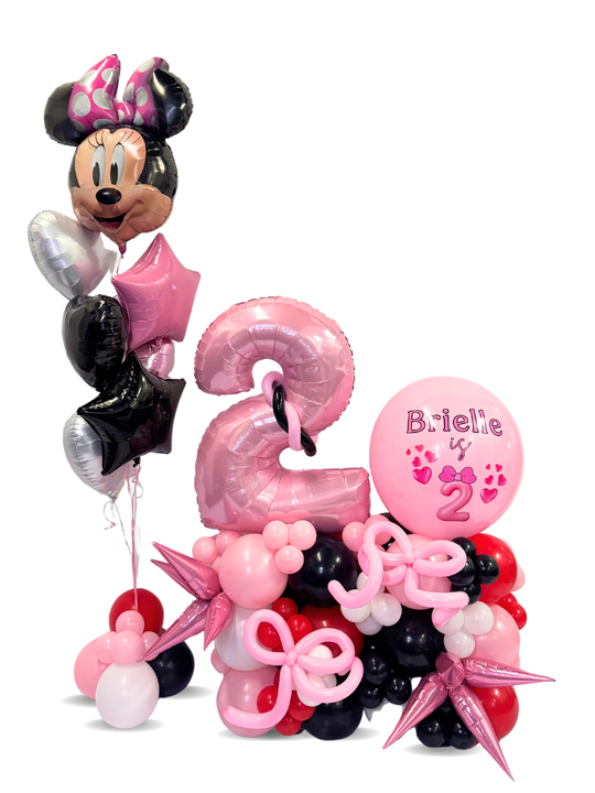 Balloon arrangement with Minnie Mouse theme for a 2nd birthday celebration.