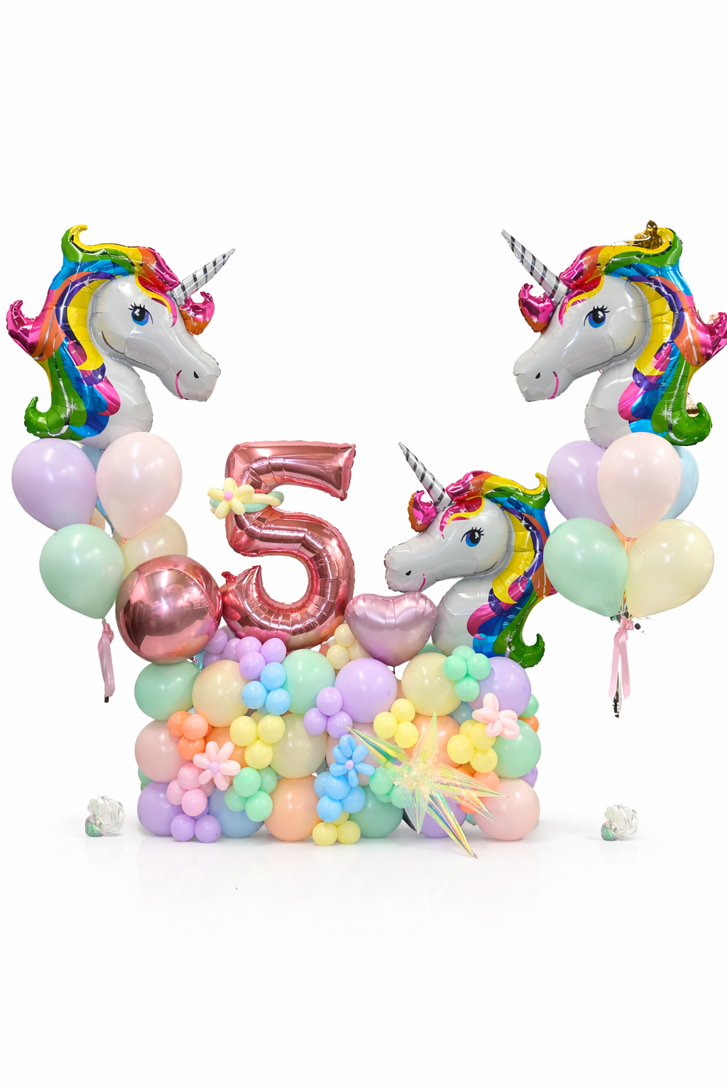Colorful unicorn-themed balloon arch with number 5 on a white background