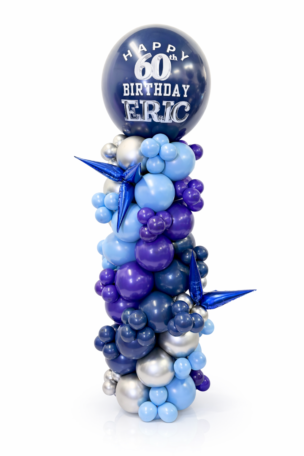 Balloon sculpture with 'Happy 60th Birthday Eric' on a white background