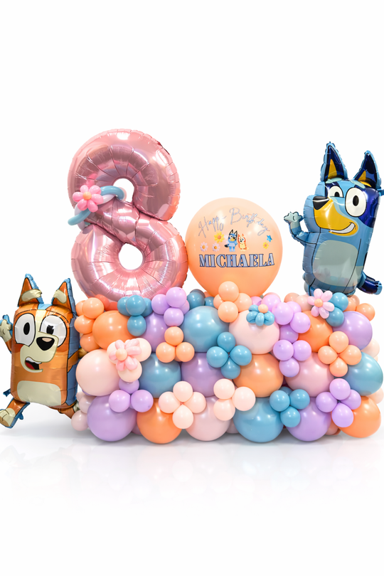 Colorful balloon arch with cartoon character balloons and a number 8 on a white background