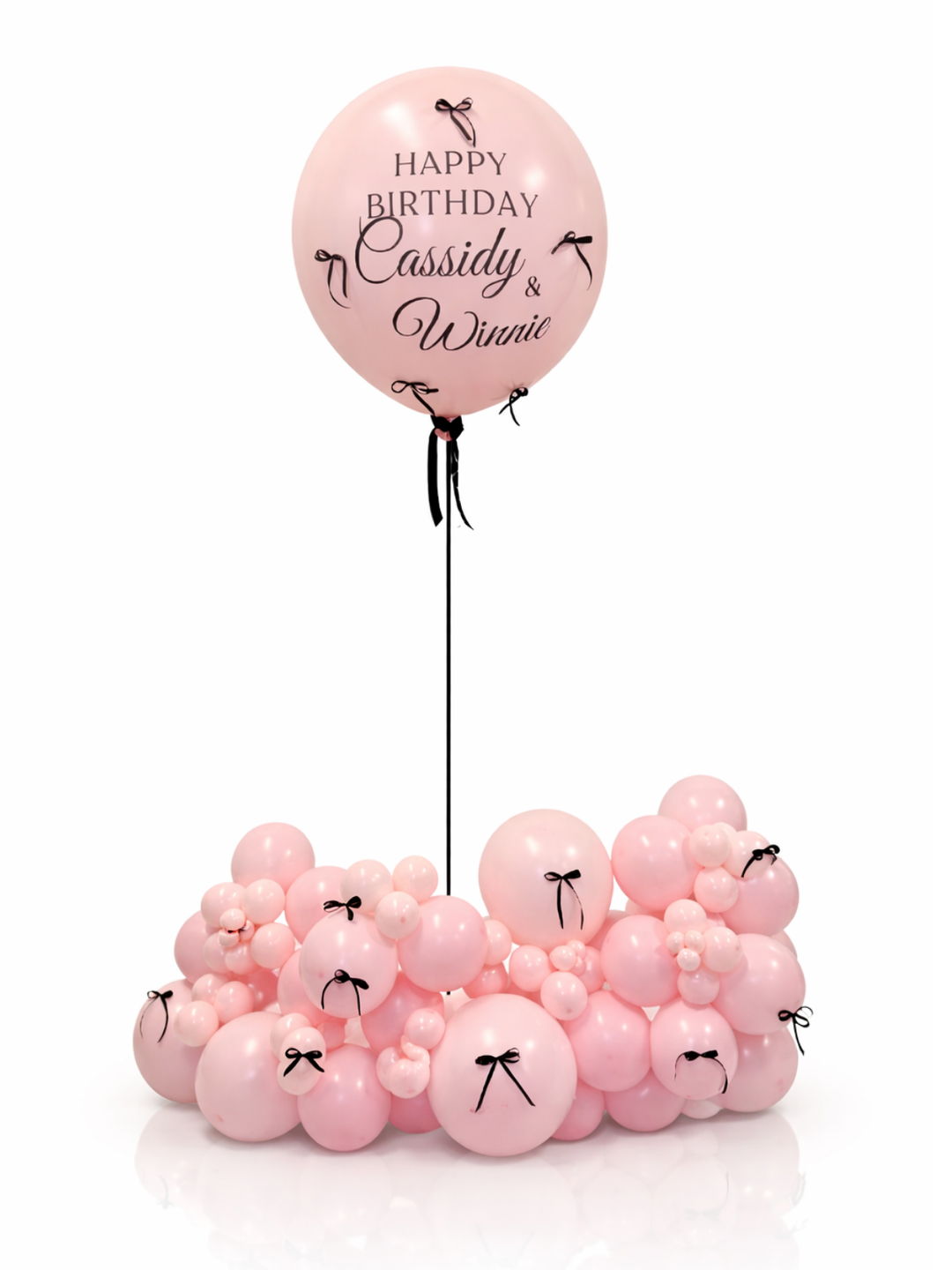 Pink balloons with personalized text on a white background