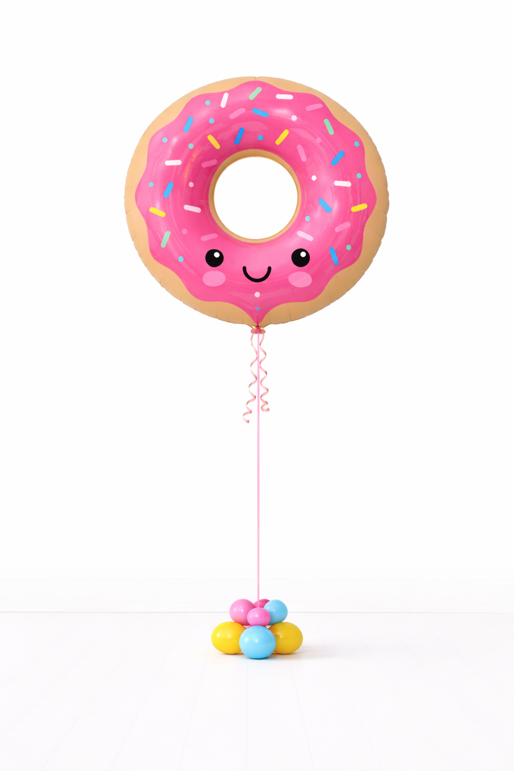 Donut-shaped balloon with a face on a white background