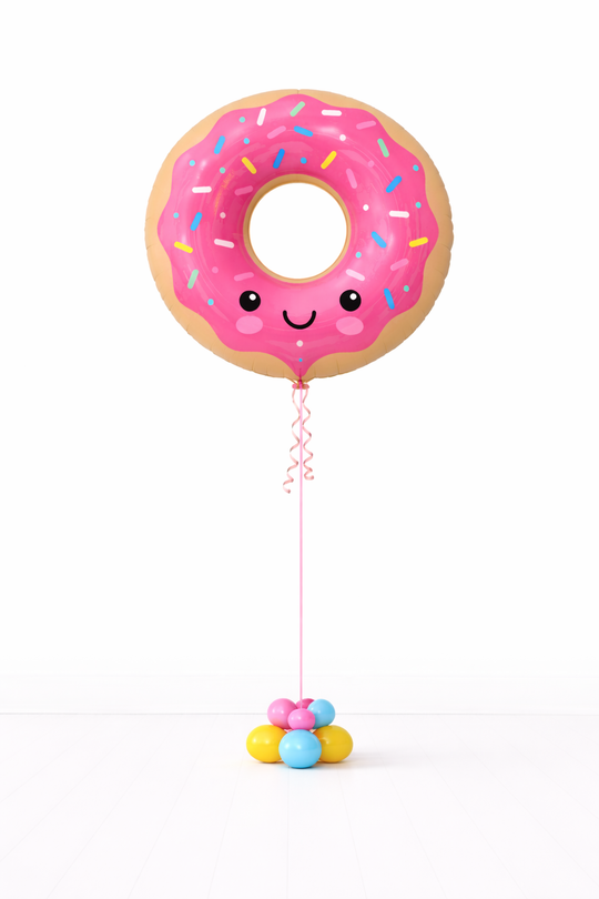 Donut-shaped balloon with a face on a white background