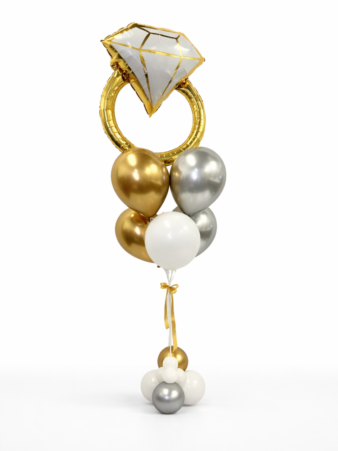 Decorative balloon bouquet with gold, silver, and white balloons tied to a diamond-shaped object on a white background.