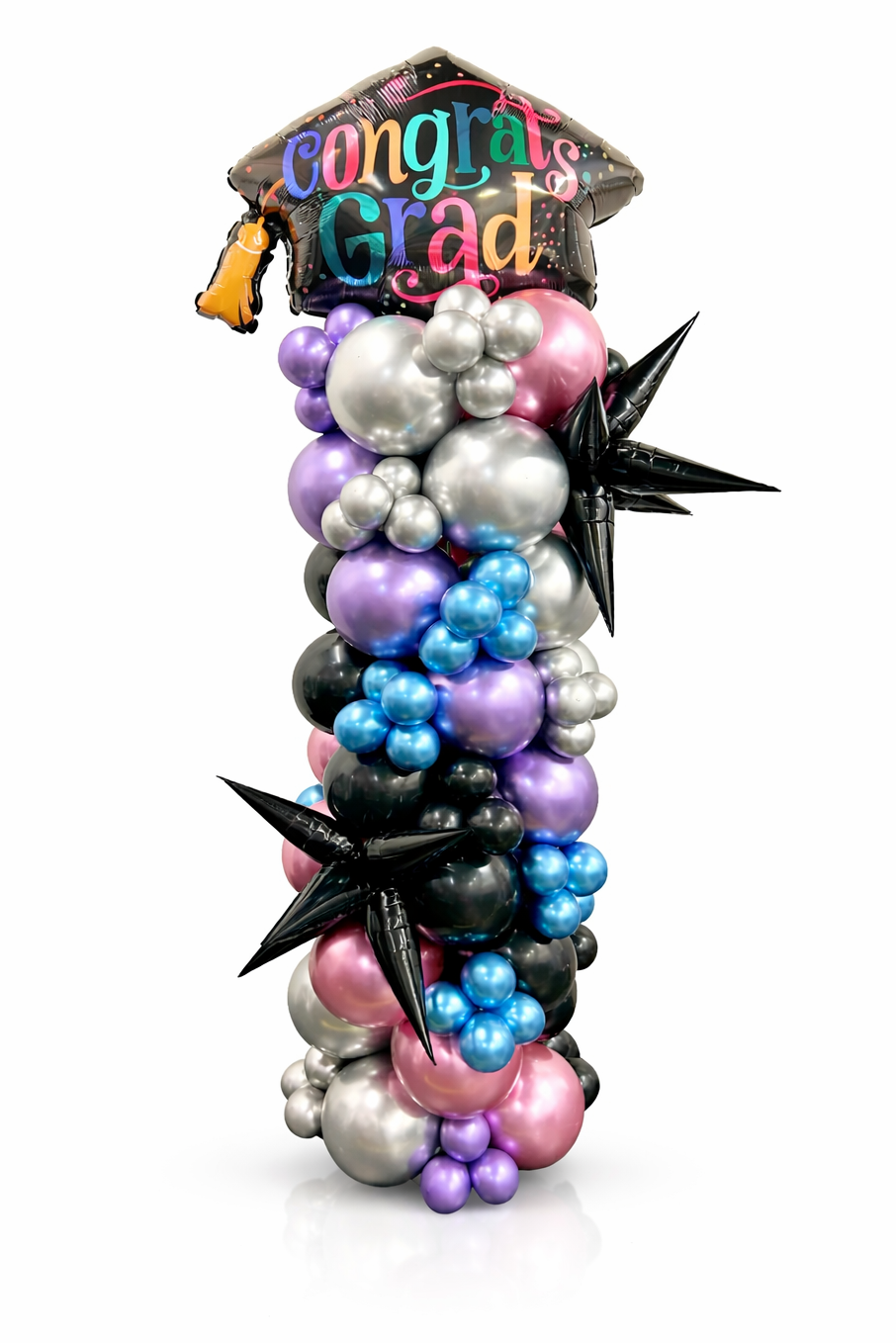 Graduation-themed balloon arrangement with colorful balloons and a 'Congrats Grad' hat on a white background.