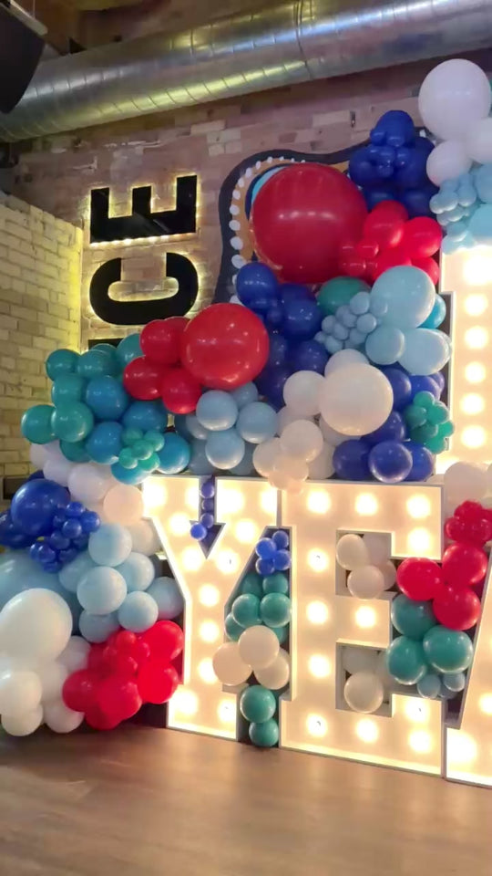 Stacked marquees and balloon garland